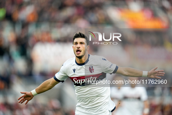 Riccardo Orsolini of Bologna FC celebrates after scoring second goal during the Serie A Enilive match between AS Roma and Bologna FC at Stad...