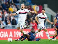 Tommaso Pobega of Bologna FC and Manu Kone' of AS Roma compete for the ball during the Serie A Enilive match between AS Roma and Bologna FC...