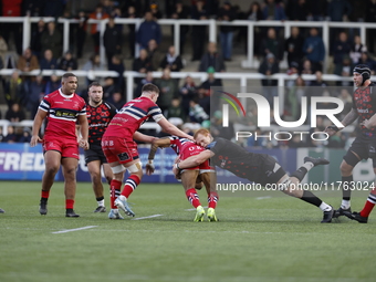 Philip van der Walt of Newcastle Falcons tackles Telusa Veainu of Doncaster Knights during the Premiership Cup Pool A match between Newcastl...