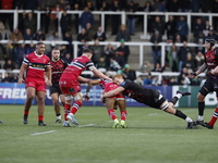 Philip van der Walt of Newcastle Falcons tackles Telusa Veainu of Doncaster Knights during the Premiership Cup Pool A match between Newcastl...