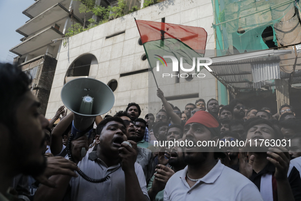 Supporters of the Bangladesh Nationalist Party chant a slogan for Sheikh Hasina's prosecution in front of the Bangladesh Awami League's Cent...