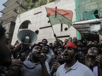 Supporters of the Bangladesh Nationalist Party chant a slogan for Sheikh Hasina's prosecution in front of the Bangladesh Awami League's Cent...