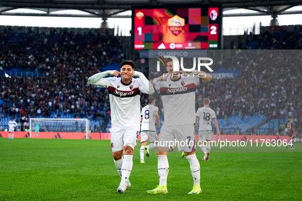 Riccardo Orsolini of Bologna FC celebrates with Santiago Castro after scoring second goal during the Serie A Enilive match between AS Roma a...