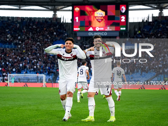 Riccardo Orsolini of Bologna FC celebrates with Santiago Castro after scoring second goal during the Serie A Enilive match between AS Roma a...