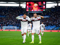 Riccardo Orsolini of Bologna FC celebrates with Santiago Castro after scoring second goal during the Serie A Enilive match between AS Roma a...