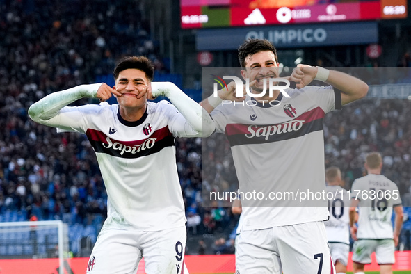 Riccardo Orsolini of Bologna FC celebrates with Santiago Castro after scoring second goal during the Serie A Enilive match between AS Roma a...