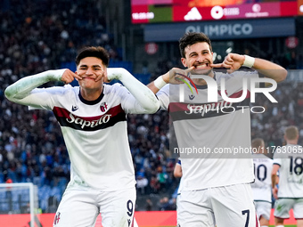 Riccardo Orsolini of Bologna FC celebrates with Santiago Castro after scoring second goal during the Serie A Enilive match between AS Roma a...