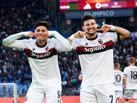 Riccardo Orsolini of Bologna FC celebrates with Santiago Castro after scoring second goal during the Serie A Enilive match between AS Roma a...