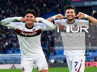 Riccardo Orsolini of Bologna FC celebrates with Santiago Castro after scoring second goal during the Serie A Enilive match between AS Roma a...