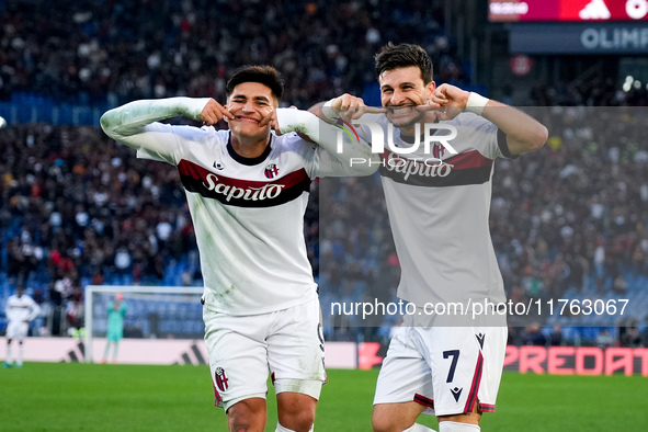 Riccardo Orsolini of Bologna FC celebrates with Santiago Castro after scoring second goal during the Serie A Enilive match between AS Roma a...