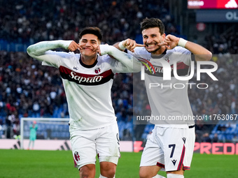 Riccardo Orsolini of Bologna FC celebrates with Santiago Castro after scoring second goal during the Serie A Enilive match between AS Roma a...