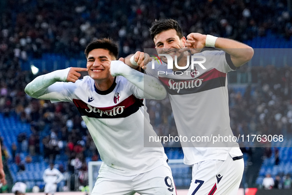 Riccardo Orsolini of Bologna FC celebrates with Santiago Castro after scoring second goal during the Serie A Enilive match between AS Roma a...