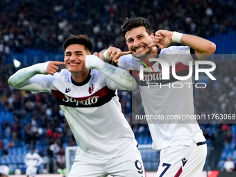 Riccardo Orsolini of Bologna FC celebrates with Santiago Castro after scoring second goal during the Serie A Enilive match between AS Roma a...