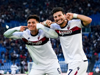 Riccardo Orsolini of Bologna FC celebrates with Santiago Castro after scoring second goal during the Serie A Enilive match between AS Roma a...