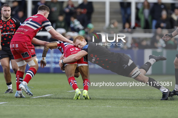 Philip van der Walt of Newcastle Falcons tackles Telusa Veainu of Doncaster Knights during the Premiership Cup Pool A match between Newcastl...