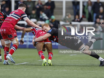 Philip van der Walt of Newcastle Falcons tackles Telusa Veainu of Doncaster Knights during the Premiership Cup Pool A match between Newcastl...