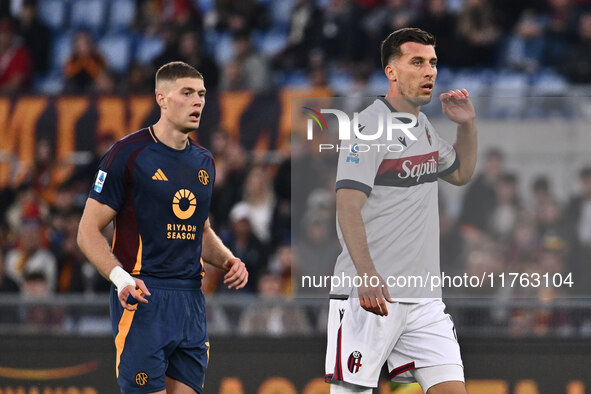 Artem Dovbyk of A.S. Roma and Nicolo Casale of Bologna F.C. participate in the 12th day of the Serie A Championship between A.S. Roma and Bo...