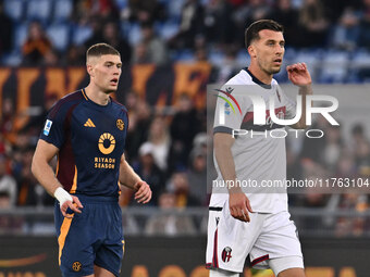 Artem Dovbyk of A.S. Roma and Nicolo Casale of Bologna F.C. participate in the 12th day of the Serie A Championship between A.S. Roma and Bo...