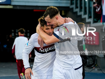 Sam Beukema of Bologna FC celebrates with Juan Miranda after Jesper Karlsson of Bologna FC scored third goal during the Serie A Enilive matc...