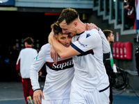 Sam Beukema of Bologna FC celebrates with Juan Miranda after Jesper Karlsson of Bologna FC scored third goal during the Serie A Enilive matc...