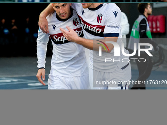 Sam Beukema of Bologna FC celebrates with Juan Miranda after Jesper Karlsson of Bologna FC scored third goal during the Serie A Enilive matc...