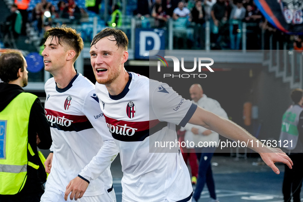 Sam Beukema of Bologna FC celebrates with Juan Miranda after Jesper Karlsson of Bologna FC scored third goal during the Serie A Enilive matc...