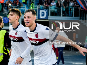 Sam Beukema of Bologna FC celebrates with Juan Miranda after Jesper Karlsson of Bologna FC scored third goal during the Serie A Enilive matc...