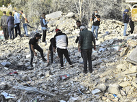 Rescuers search for survivors at the site of an Israeli airstrike that targets the village of Almat north of Beirut, Lebanon, on November 10...