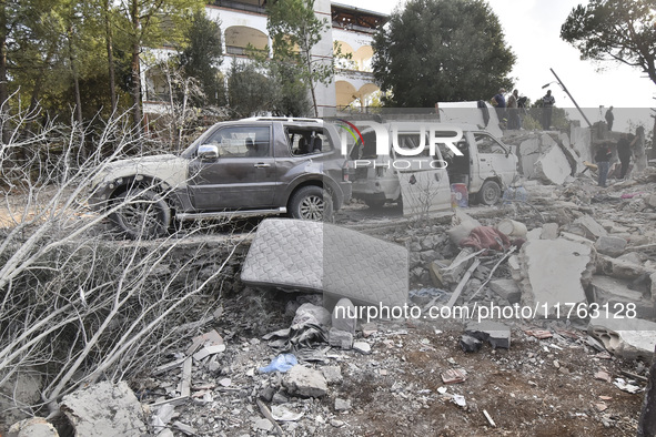 Rescuers search for survivors at the site of an Israeli airstrike that targets the village of Almat north of Beirut, Lebanon, on November 10...