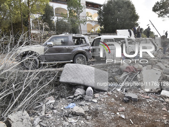 Rescuers search for survivors at the site of an Israeli airstrike that targets the village of Almat north of Beirut, Lebanon, on November 10...