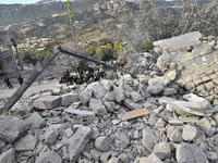 Rescuers search for survivors at the site of an Israeli airstrike that targets the village of Almat north of Beirut, Lebanon, on November 10...