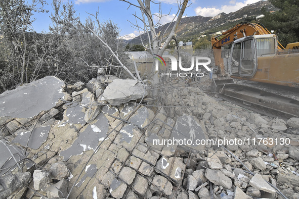 Rescuers search for survivors at the site of an Israeli airstrike that targets the village of Almat north of Beirut, Lebanon, on November 10...