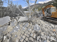 Rescuers search for survivors at the site of an Israeli airstrike that targets the village of Almat north of Beirut, Lebanon, on November 10...