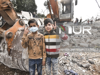 Rescuers search for survivors at the site of an Israeli airstrike that targets the village of Almat north of Beirut, Lebanon, on November 10...