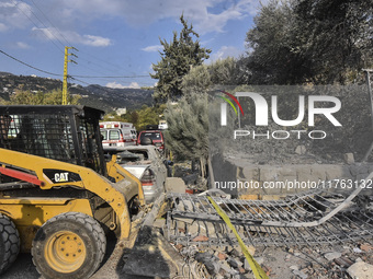 Rescuers search for survivors at the site of an Israeli airstrike that targets the village of Almat north of Beirut, Lebanon, on November 10...