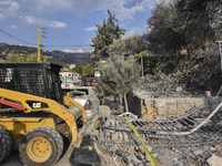 Rescuers search for survivors at the site of an Israeli airstrike that targets the village of Almat north of Beirut, Lebanon, on November 10...