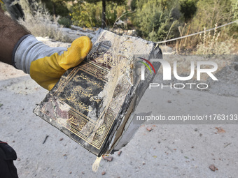 Rescuers search for survivors at the site of an Israeli airstrike that targets the village of Almat north of Beirut, Lebanon, on November 10...