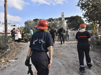 Rescuers search for survivors at the site of an Israeli airstrike that targets the village of Almat north of Beirut, Lebanon, on November 10...