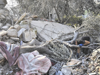 Rescuers search for survivors at the site of an Israeli airstrike that targets the village of Almat north of Beirut, Lebanon, on November 10...