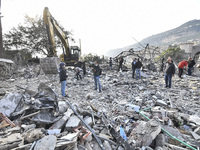 Rescuers search for survivors at the site of an Israeli airstrike that targets the village of Almat north of Beirut, Lebanon, on November 10...