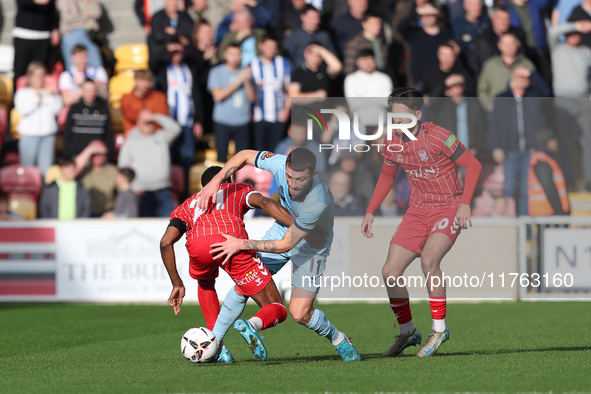 Luke Charman of Hartlepool United battles with Cameron John of York City during the Vanarama National League match between York City and Har...