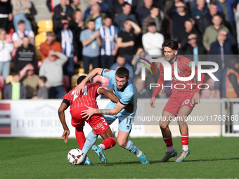 Luke Charman of Hartlepool United battles with Cameron John of York City during the Vanarama National League match between York City and Har...