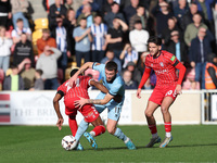 Luke Charman of Hartlepool United battles with Cameron John of York City during the Vanarama National League match between York City and Har...