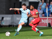 Luke Charman of Hartlepool United battles for possession with Cameron John of York City during the Vanarama National League match between Yo...