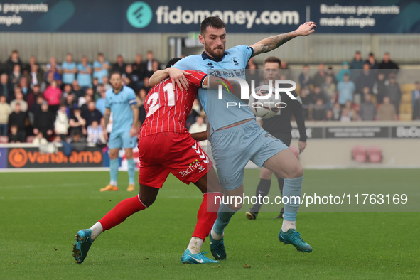 Luke Charman of Hartlepool United competes with York City's Cameron John during the Vanarama National League match between York City and Har...