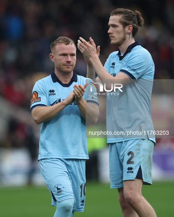 Daniel Dodds and Adam Campbell of Hartlepool United applaud their traveling fans during the Vanarama National League match between York City...