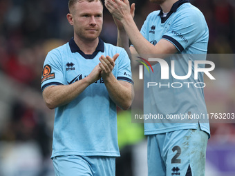 Daniel Dodds and Adam Campbell of Hartlepool United applaud their traveling fans during the Vanarama National League match between York City...