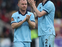 Daniel Dodds and Adam Campbell of Hartlepool United applaud their traveling fans during the Vanarama National League match between York City...