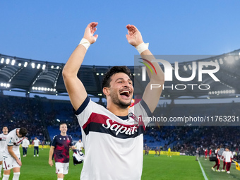 Riccardo Orsolini of Bologna FC celebrates the victory at the end of the Serie A Enilive match between AS Roma and Bologna FC at Stadio Olim...