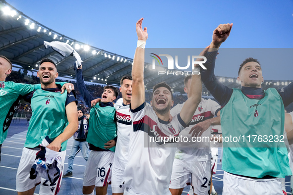 Riccardo Orsolini of Bologna FC and his team-mates celebrate the victory at the end of the Serie A Enilive match between AS Roma and Bologna...